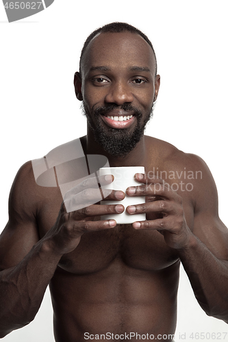 Image of African man with cup of tea, isolated on white background