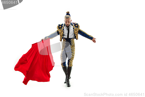 Image of Torero in blue and gold suit or typical spanish bullfighter isolated over white