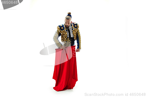 Image of Torero in blue and gold suit or typical spanish bullfighter isolated over white