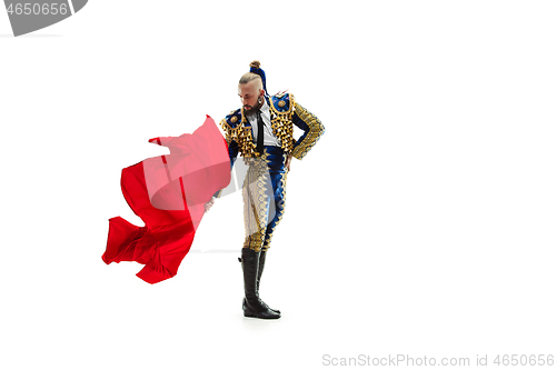 Image of Torero in blue and gold suit or typical spanish bullfighter isolated over white