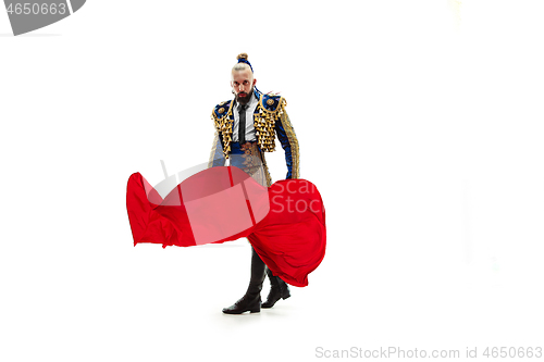 Image of Torero in blue and gold suit or typical spanish bullfighter isolated over white