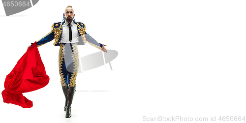 Image of Torero in blue and gold suit or typical spanish bullfighter isolated over white