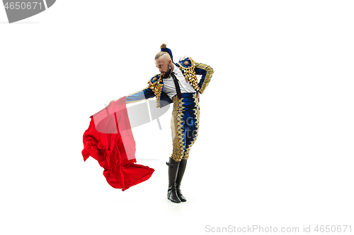 Image of Torero in blue and gold suit or typical spanish bullfighter isolated over white