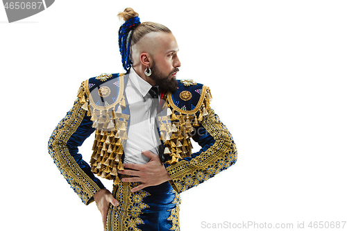 Image of Torero in blue and gold suit or typical spanish bullfighter isolated over white