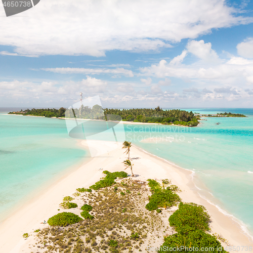 Image of Picture perfect beach and turquoise lagoon on small tropical island on Maldives