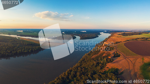 Image of Aerial drone view of river landscape in sunny summer evening