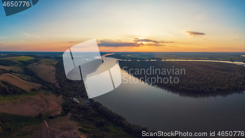 Image of Aerial drone view of river landscape in sunny summer evening