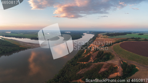 Image of Aerial drone view of river landscape in sunny summer evening