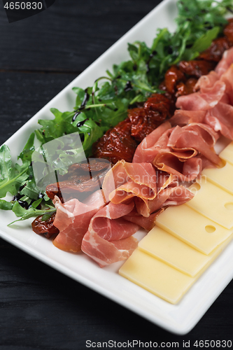 Image of prosciutto cheese and sun-dried tomatoes