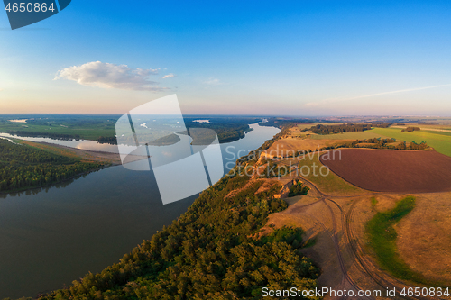 Image of Aerial drone view of river landscape in sunny summer evening