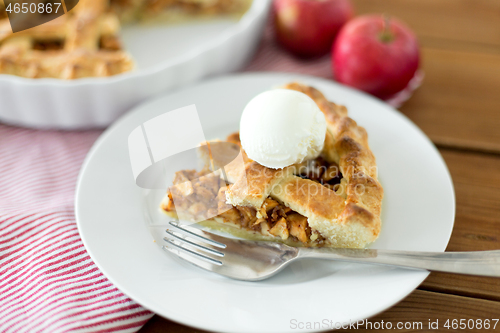 Image of piece of apple pie with ice cream on plate