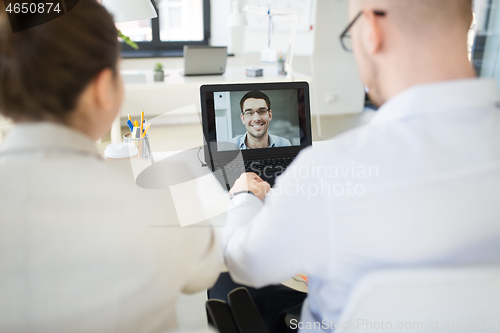 Image of business team having video conference at office