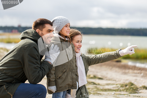 Image of happy family on autumn beach