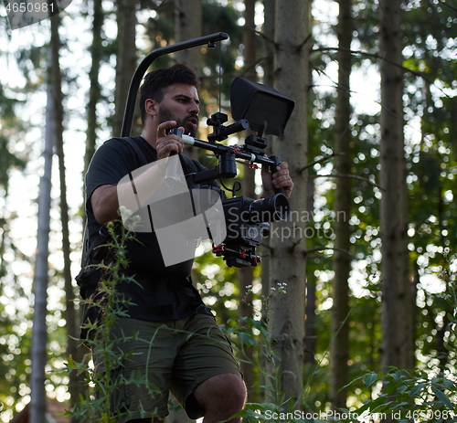 Image of Videographer Taking Action Shoot of Soldiers in Action