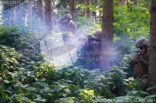Image of Modern warfare Soldiers  Squad  in battle