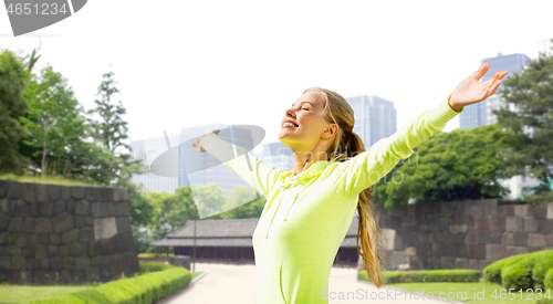 Image of happy woman in sports clothes