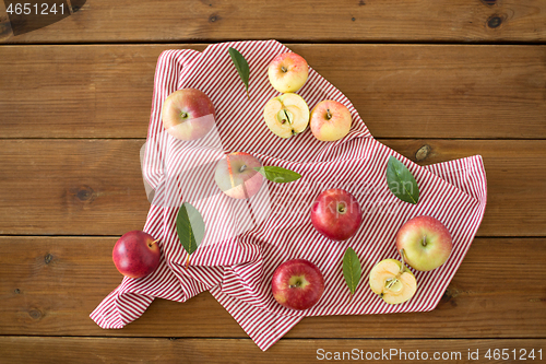 Image of ripe red apples on wooden table