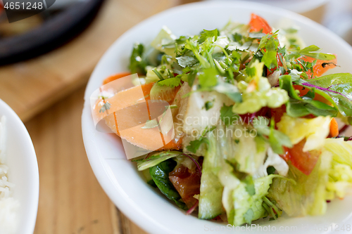 Image of vegetable salad in bowl at indian restaurant