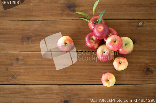 Image of ripe red apples on wooden table