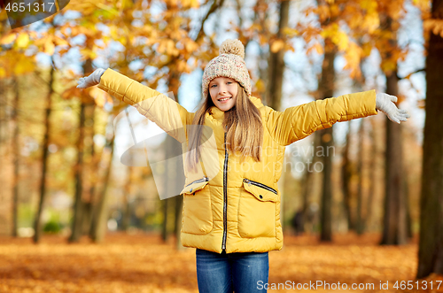 Image of happy girl at autumn park