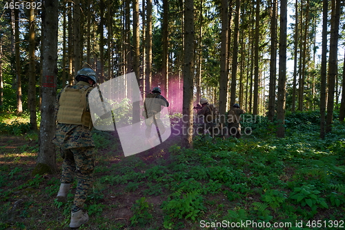 Image of Modern warfare Soldiers  Squad  in battle