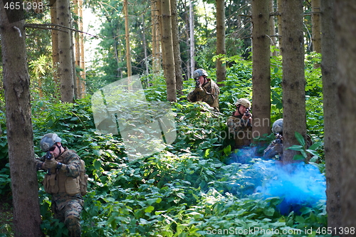 Image of Modern warfare Soldiers  Squad  in battle