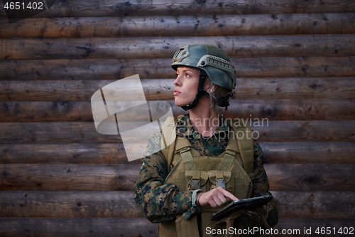 Image of woman soldier using tablet computer