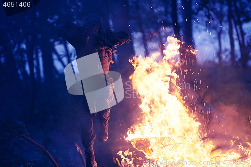 Image of Soldier in Action at Night