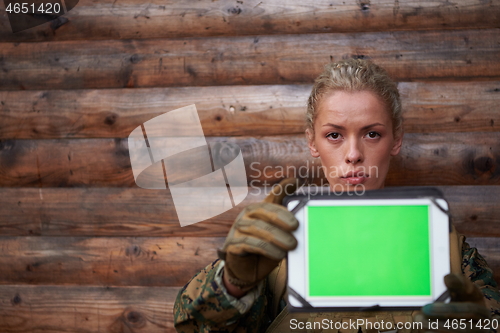 Image of woman soldier using tablet computer