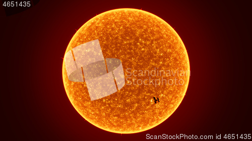 Image of sun with International Space Station