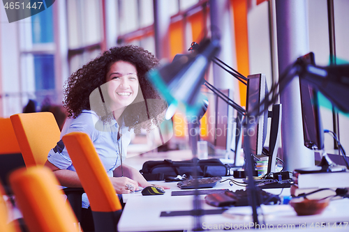 Image of young  business woman at office