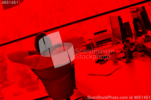 Image of happy young business man at office