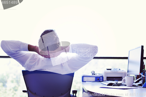 Image of happy young business man at office