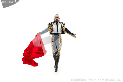 Image of Torero in blue and gold suit or typical spanish bullfighter isolated over white