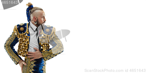 Image of Torero in blue and gold suit or typical spanish bullfighter isolated over white