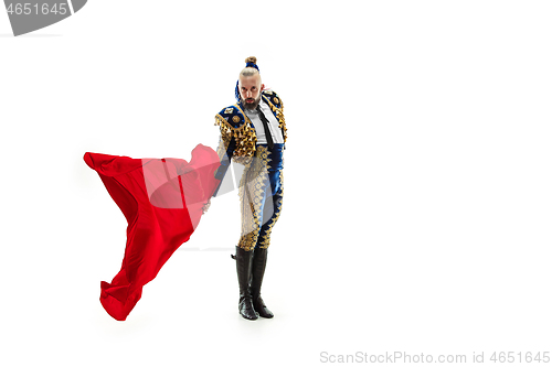 Image of Torero in blue and gold suit or typical spanish bullfighter isolated over white