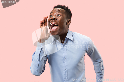 Image of Isolated on pink young casual man shouting at studio