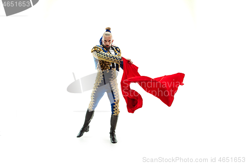 Image of Torero in blue and gold suit or typical spanish bullfighter isolated over white