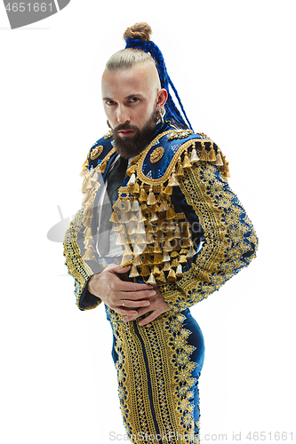 Image of Torero in blue and gold suit or typical spanish bullfighter isolated over white