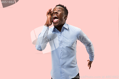 Image of Isolated on pink young casual man shouting at studio