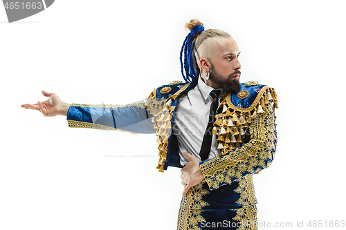 Image of Torero in blue and gold suit or typical spanish bullfighter isolated over white