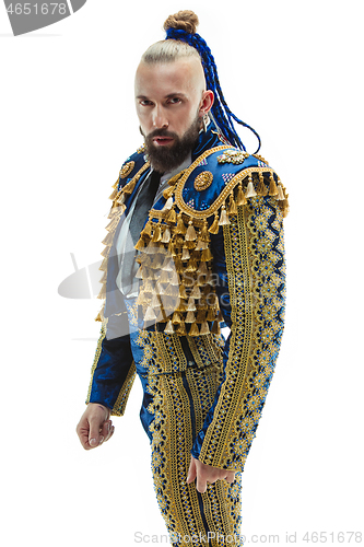 Image of Torero in blue and gold suit or typical spanish bullfighter isolated over white