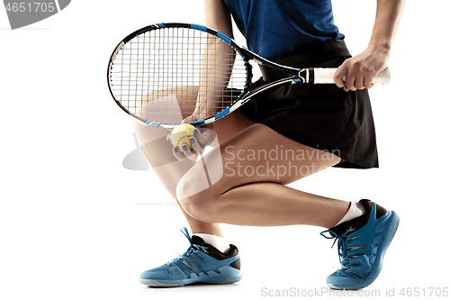 Image of Full length portrait of young woman playing tennis isolated on white background