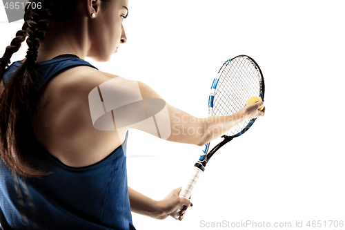 Image of Full length portrait of young woman playing tennis isolated on white background