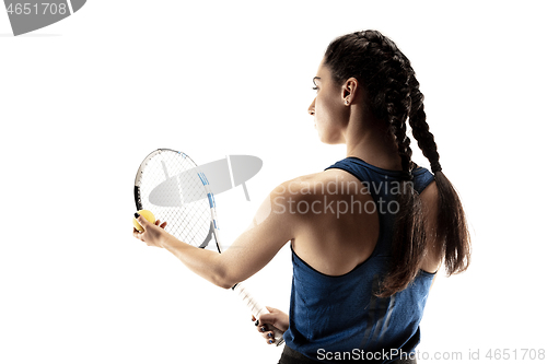 Image of Full length portrait of young woman playing tennis isolated on white background