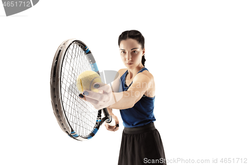 Image of Full length portrait of young woman playing tennis isolated on white background