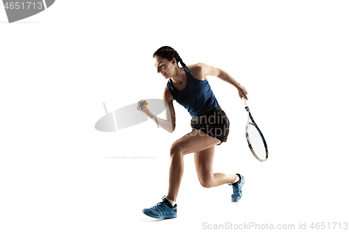 Image of Full length portrait of young woman playing tennis isolated on white background