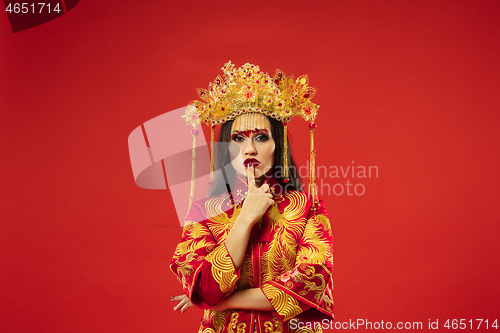 Image of Chinese traditional woman. Beautiful young girl wearing in national costume