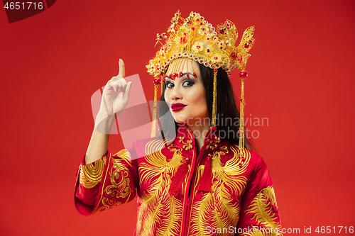 Image of Chinese traditional woman. Beautiful young girl wearing in national costume