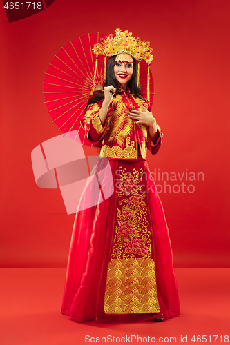 Image of Chinese traditional woman. Beautiful young girl wearing in national costume